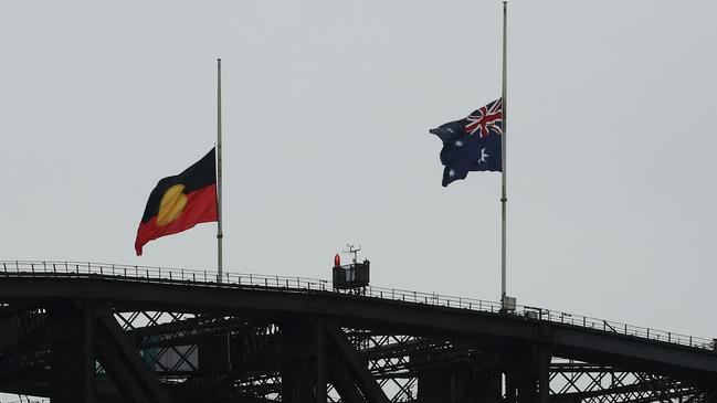 Flags are seen at half-mast on the Sydney Harbour ridge as a mark of mourning and respect for Queen Elizabeth II. Picture: Mark Metcalfe / Getty Images