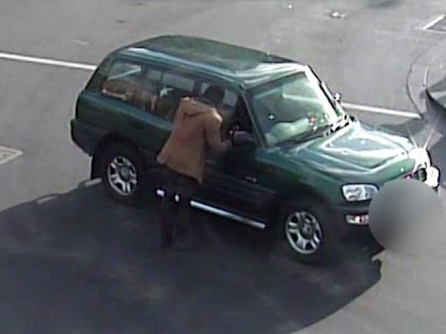 A man checks on the teenager inside the car.