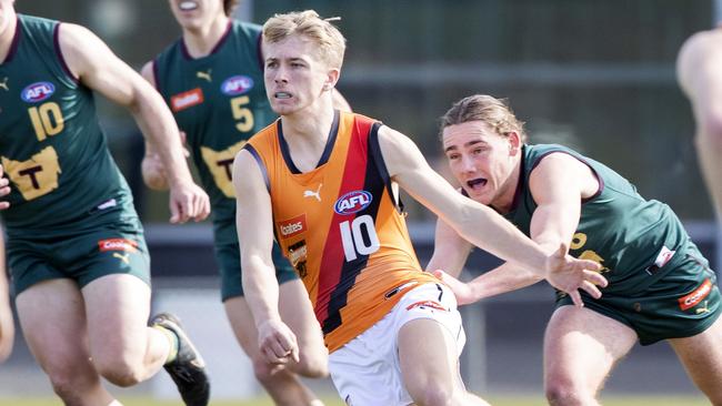 Tasmania Devils Connor Ling and Calder Cannons Damon Hollow at KGV Oval.  Picture: Chris Kidd