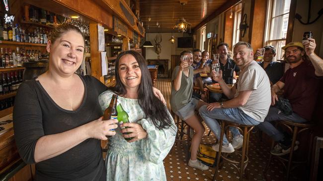 Alrounder Monica McIntyre and venue manager Shannon Ruffles celebrate the sale of the Hope &amp; Anchor Tavern. Picture: Chris Kidd