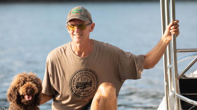 Daintree River wildlife expert David White, of Solar Whisper Crocodile and Wildlife Cruises, with his trusty dog Dougie. Picture: Mark Murray