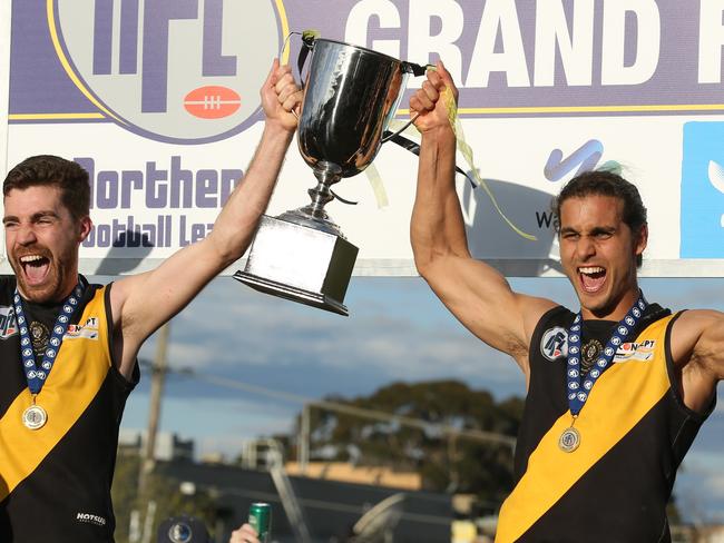 Michael Brunelli, right, celebrates the 2016 premiership with Charles Gaylord. 