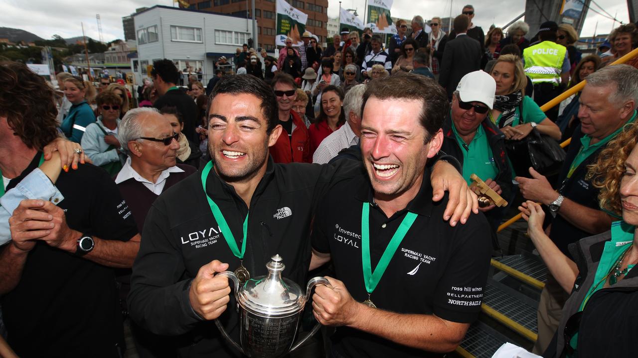 Former NRL player Anthony Minichiello and Stefanovic celebrating line honours after supermaxi Investec Loyal won the 2011 Sydney to Hobart Yacht Race.