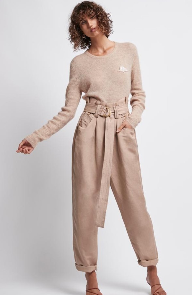 An knit and relaxed pants could be the new office uniform as seen on this model, wearing Aje Rigby knit ($275) and Aje Paperbark linen pants ($295).