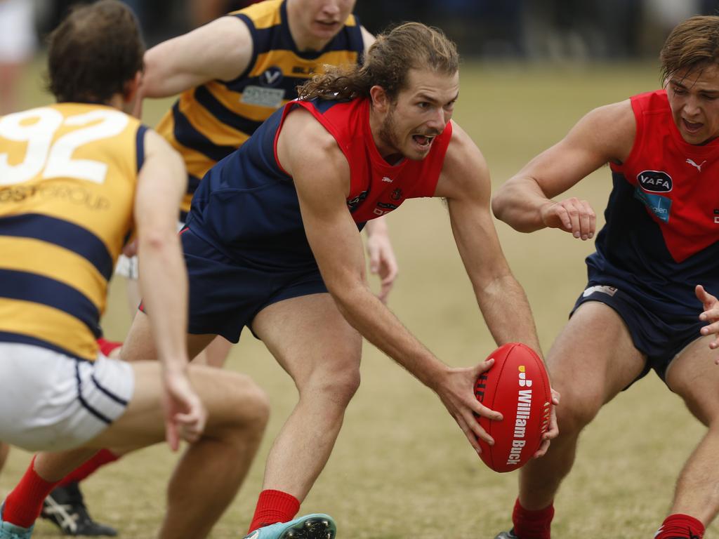 VAFA: Reuben Hayward collects the pill for Old Brighton. Picture: Valeriu Campan