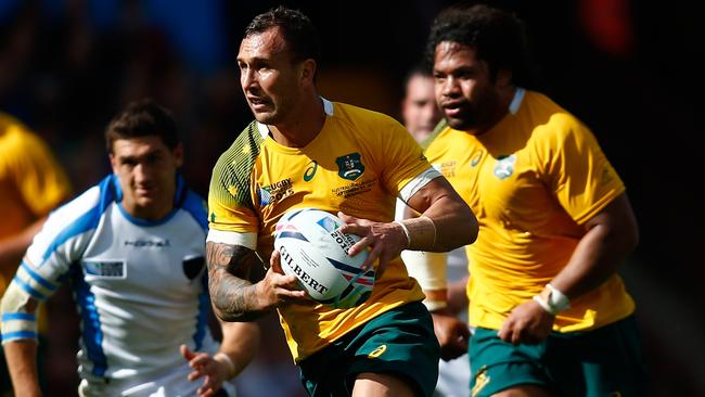 BIRMINGHAM, ENGLAND - SEPTEMBER 27: Quade Cooper of Australia attempts to break through during the 2015 Rugby World Cup Pool A match between Australia and Uruguay at Villa Park on September 27, 2015 in Birmingham, United Kingdom. (Photo by Laurence Griffiths/Getty Images)