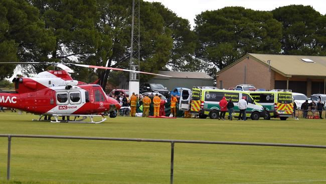 The MedSTAR helicopter and ambulances on Two Wells oval after Craig Wilson’s nasty fall on Saturday. Picture: Daniel Baldwin