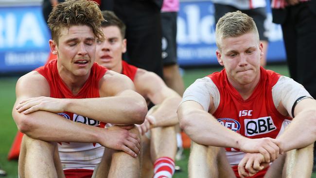 Dane Rampe and Dan Hannebery after Sydney's loss in the 2014 AFL Grand Final. Phil Hillyard