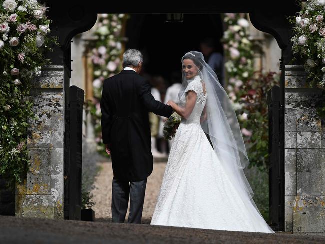 Pippa Middleton escorted by her father Michael Middleton for her wedding to James Matthews at St Mark's Church in Englefield. Picture: Justin Tallis