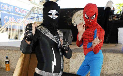 Carl Barrow, in a Captain Lightning outfit, and Rylan Adams, dressed as Spiderman, use their powers at the Superhero fun day to raise money for Blake Rose. Photo: . Picture: Mike Knott