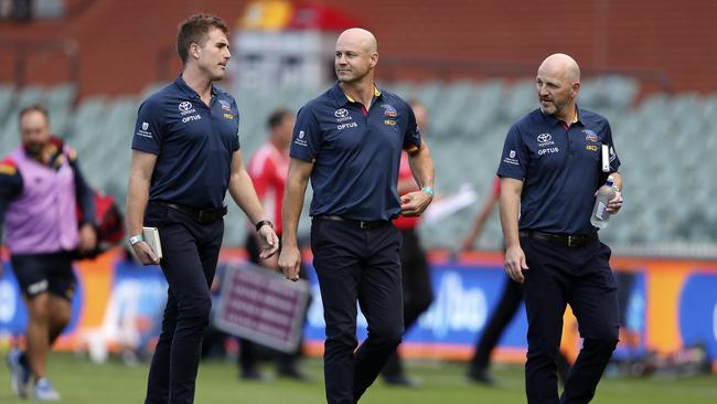 Matthew Nicks (centre) walks back to the coaches box after half time during the Crows versus Sydney round one game at Adelaide Oval. Picture SARAH REED
