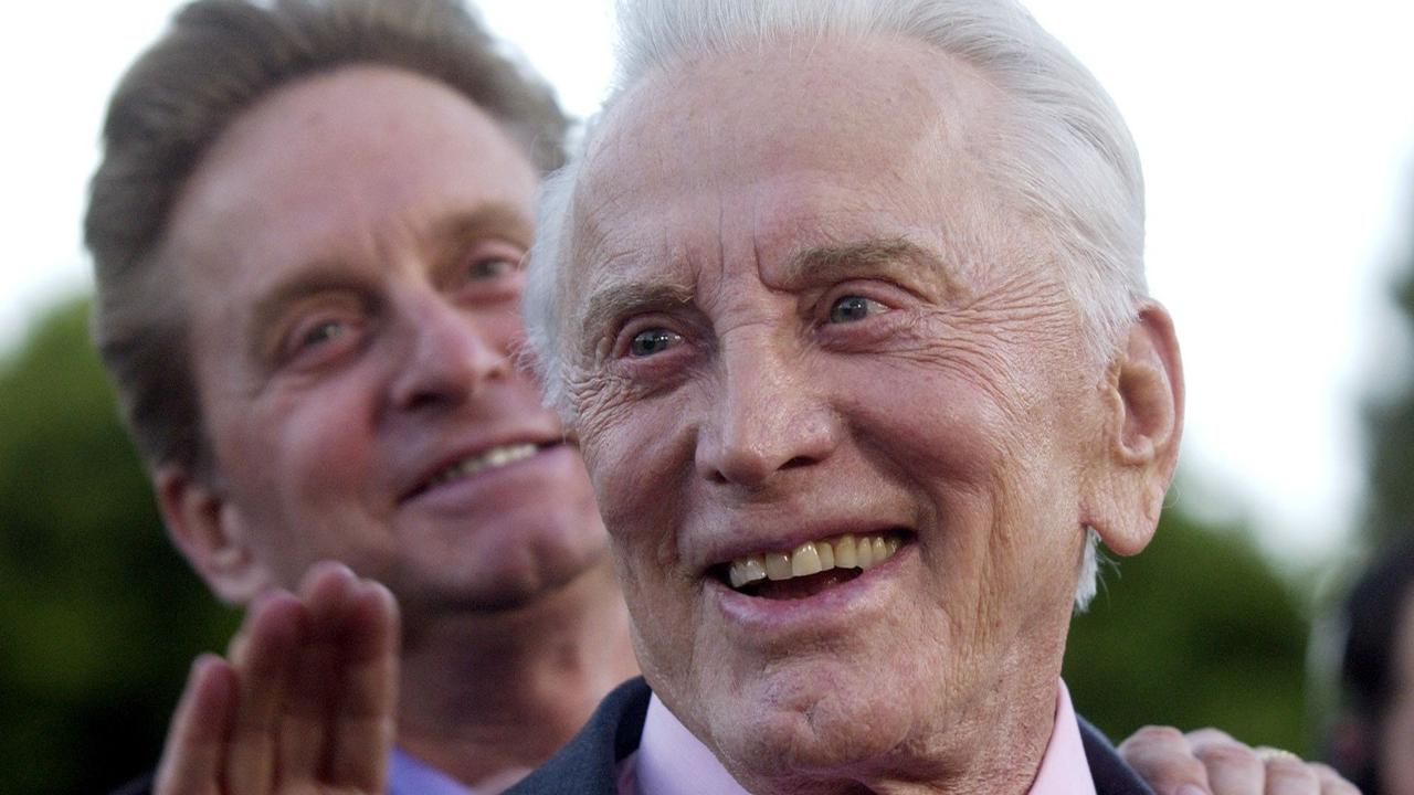 Kirk Douglas, front, with his actor son Michael at a special screening of film ‘It Runs in The Family’ - a 2003 comedy-drama movie directed by Fred Schepisi and starring three generations of the Douglas family.