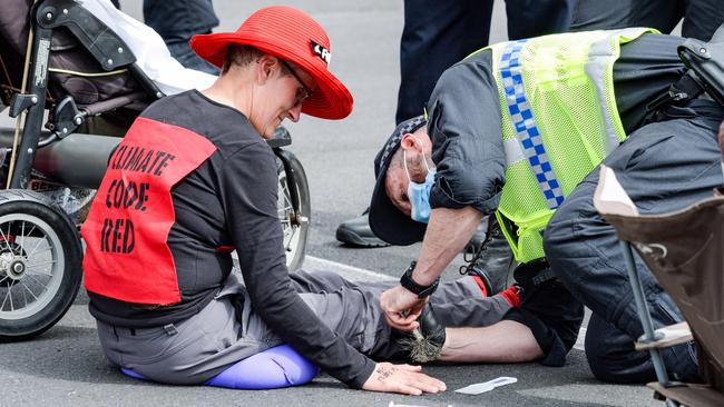 Police use Acetone to extract Extinction Rebellion protesters from King William St in Victoria Square. Picture: Brenton Edwards