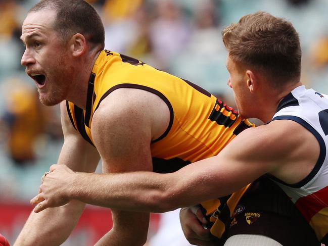 AFL Round 2. Hawthorn vs. Adelaide Crows at the MCG.  Jarryd Roughead clears by hand    . Pic: Michael Klein