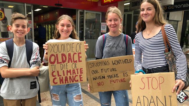 Climate change protest in Manly. Pictured: Robbie Graham, 11, of Belrose, who goes to Kamaroi School, Ember McCabe, 14, of Narrabeen and Chelsea McLerie, 14, of Terrey Hills, both Mater Maria students and Charlotte Wood, 14, of Narrabeen, from Mackellar Girls. Picture: Julie Cross.