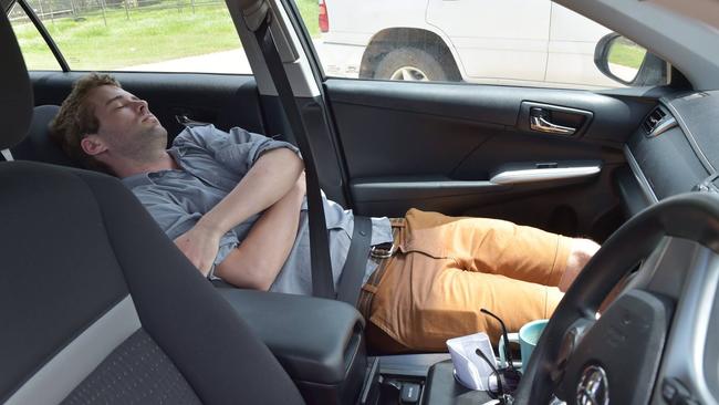 Craig Dunlop pretending to sleep while working. He likes to lull his target into a false sense of security. Picture: Facebook