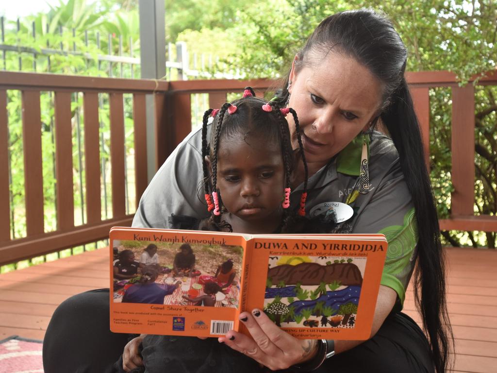 A Gunbalanya School teacher reads with one of her students. Picture: Sierra Haigh