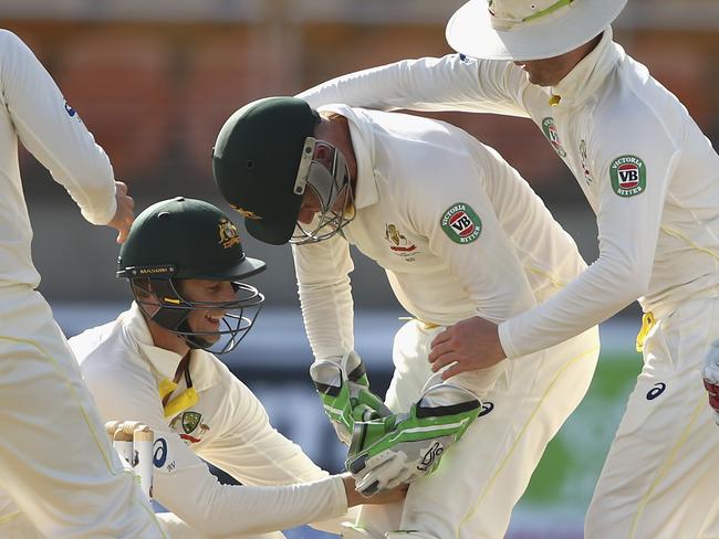 Adam Voges getting a little close to Brad Haddin after he took a catch between his legs.