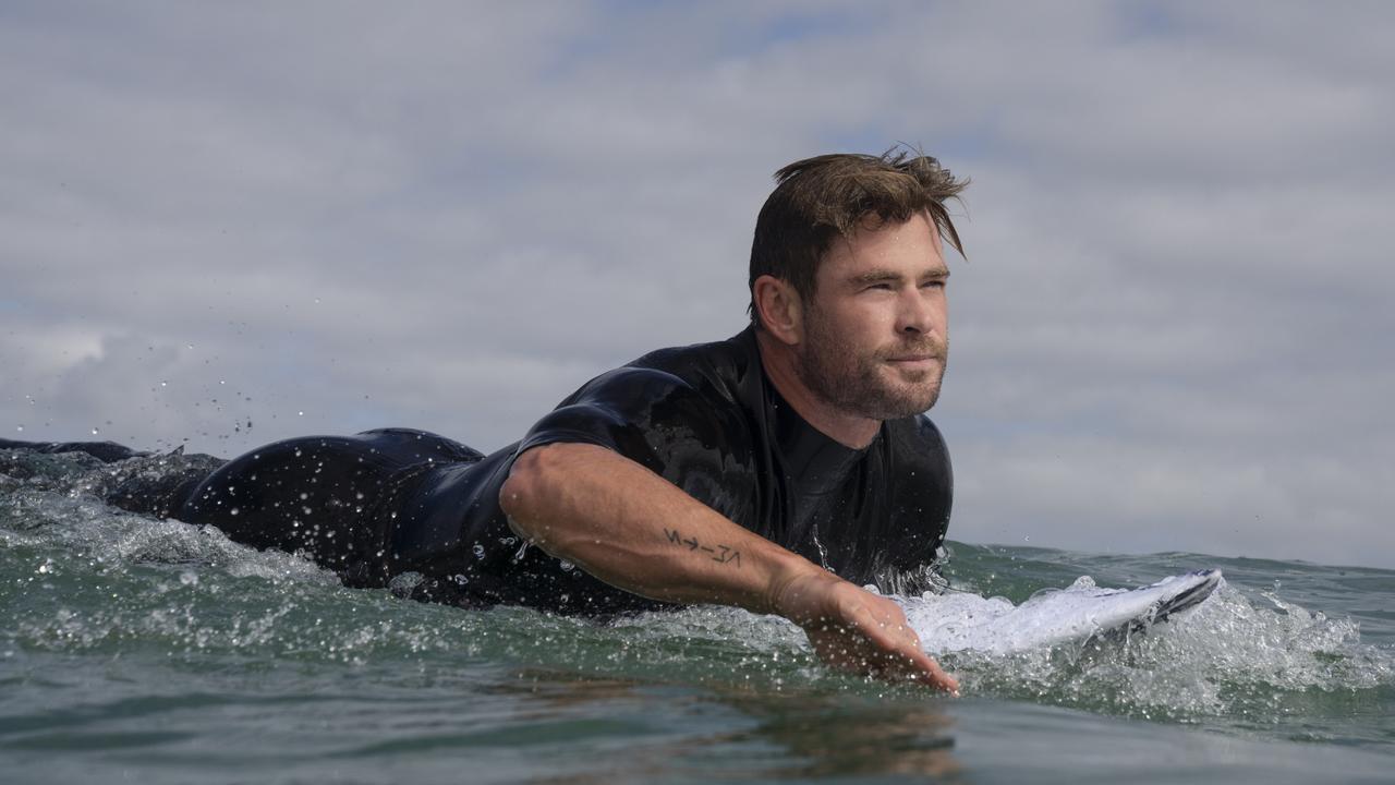 EMBARGOED FOR TUESDAY 5TH JULY TO RUN WITH KATHY MCCABE STORYCONTACT ADRIAN AT NWK PIC DESKChris Hemsworth paddling out to surf.  (National Geographic/Craig Parry)