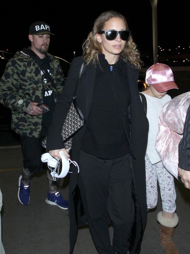 Nicole Richie was spotted catching a flight with her husband Joel Madden and their two kids. Picture: Backgrid