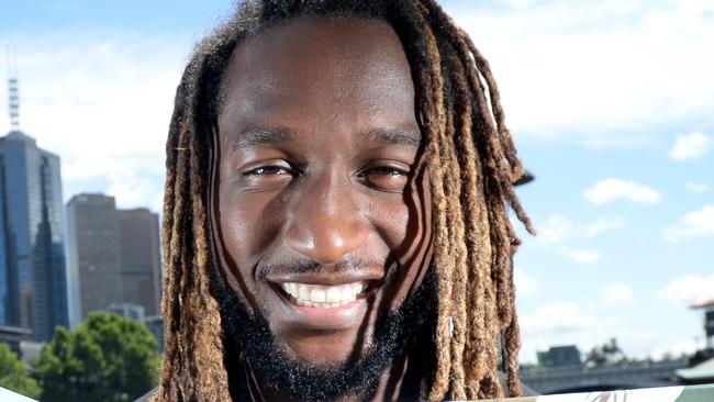 Nic Naitanui with his children's book, Little Nic's Big Day. Picture: Andrew Henshaw