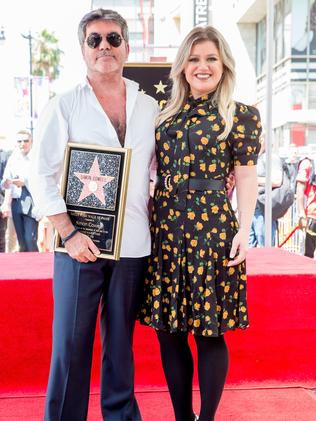 With friend Simon Cowell. Picture: Getty