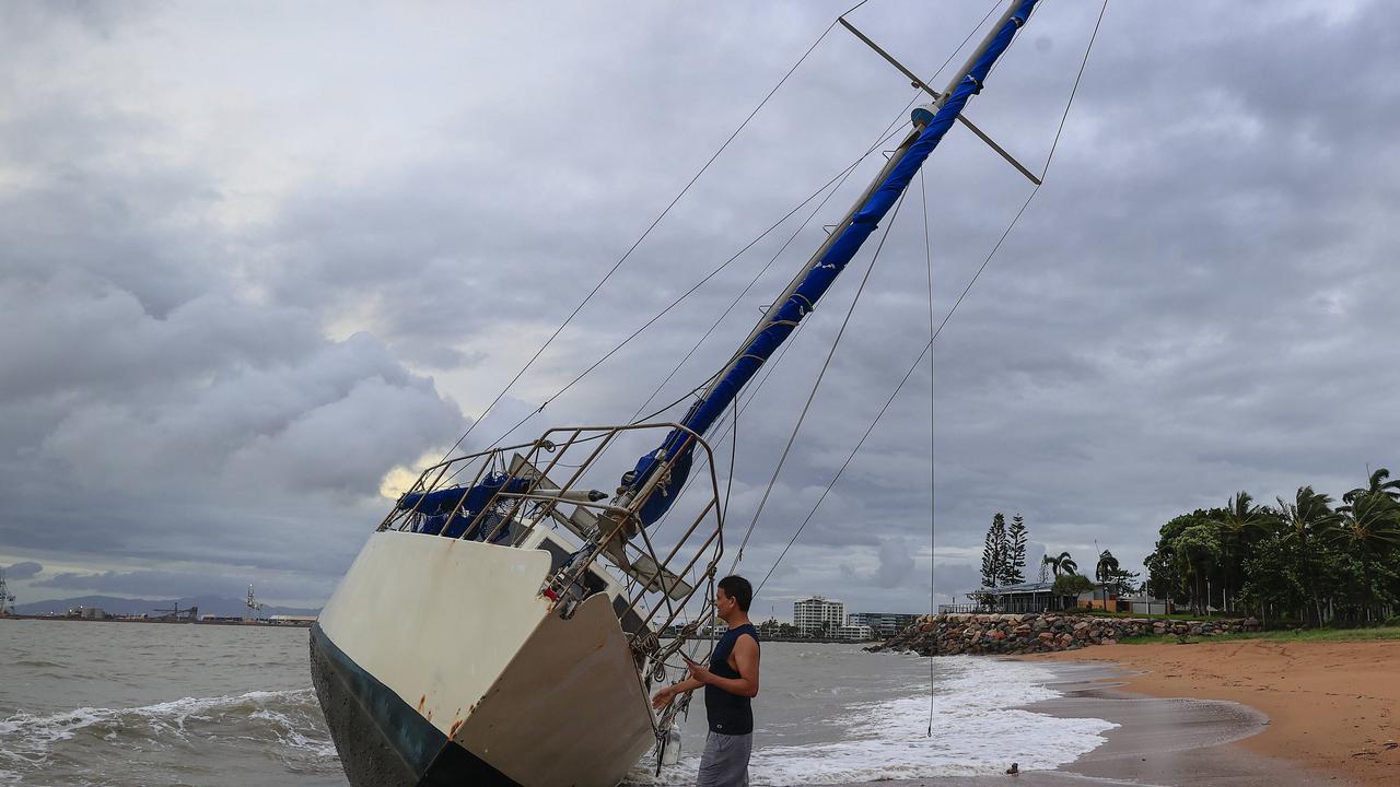 Townsville locals including Dr Deepak Doshi woke early to inspect the damage along The Strand left from TC Kirrily that hit overnight. Pics Adam Head