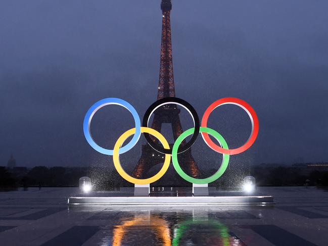 (FILES) A picture shows the Olympics Rings on the Trocadero  Esplanade near the Eiffel Tower in Paris, on September 13, 2017, after the  International Olympic Committee named Paris host city of the 2024 Summer Olympic Games. The Olympic rings will be installed on the Eiffel Tower for the Paris 2024 Olympic Games, it was learned from the site's operator said on April 8, 2024. (Photo by CHRISTOPHE SIMON / AFP)