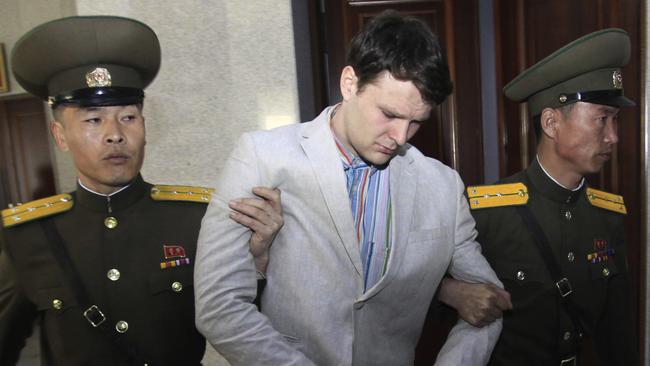 FILE - In this March 16, 2016, file photo, American student Otto Warmbier, center, is escorted at the Supreme Court in Pyongyang, North Korea. North Korea reportedly insisted the U.S. pay $2 million in medical costs in 2017 before it released dWarmbier while he was in a coma. (AP Photo/Jon Chol Jin, File)