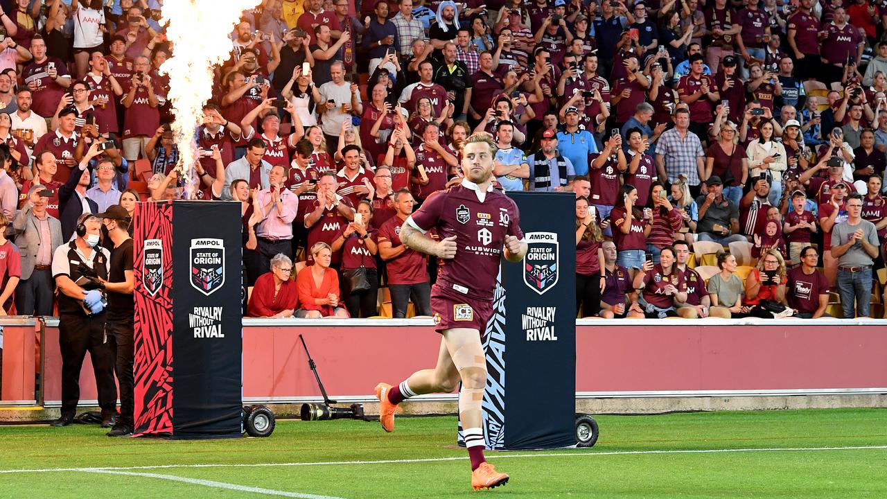 Cameron Munster runs onto the field at Suncorp Stadium in last year’s State of Origin series decider. Picture: Bradley Kanaris/Getty Images