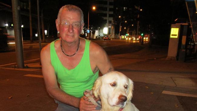 Blair Lester with his Golden Retriever Josh going for a walk from their Circle on Cavill apartment