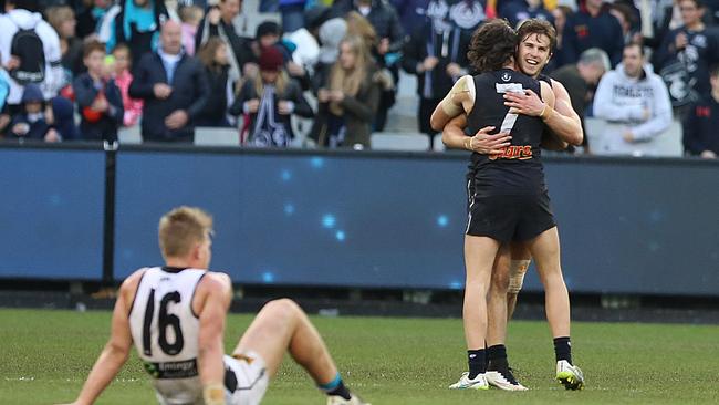 Carlton captain Marc Murphy and former player Dylan Buckley celebrate their win against Port Adelaide at the MCG in 2015. Picture: Alex Coppel.