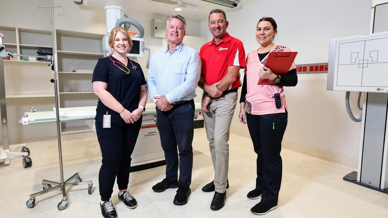 The $26.4 million Cairns Hospital emergency department expansion at the Cairns Hospital is complete, with six additional beds, a dedicated ED X-ray suite, new acute care rooms and upgraded resuscitation bays now being used by emergency patients. Cairns Hospital emergency department clinical nurse Sharnee Dalglish, Member for Cairns Michael Healy, Member for Barron River Craig Crawford and clinical nurse Lerisa Simpson-Harris inspect the emergency department's new X-ray suite. Picture: Brendan Radke