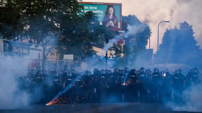 Police launch tear gas and fire rubber bullets toward protesters and the media near the 5th police precinct in Minneapolis, Minnesota. Picture: AFP