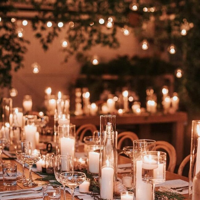 A candlelit wedding in a cosy barn designed by Everlasting Event Co. Picture: Everlasting Event Co