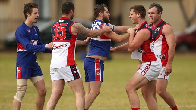 Thomas Stirling of Gepps Cross clashes with Ashley Clifton of Eastern Park on Saturday, July 8, 2017. (AAP Image/James Elsby)