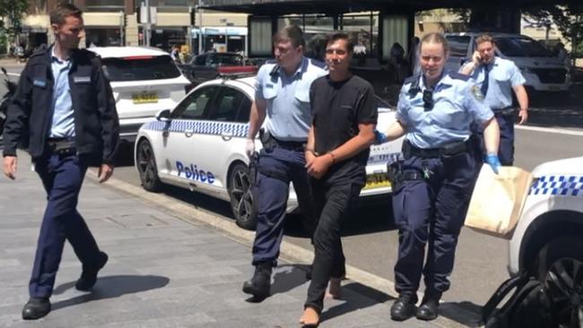 Police arrest Jack McLean on Wednesday morning. Picture: Jim O’Rourke