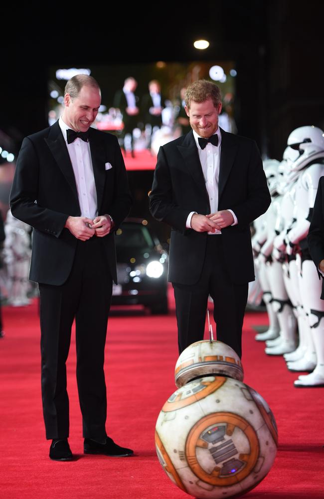 Prince William and Prince Harry are greeted by droid BB-8 as they arrive for the European Premiere of Star Wars: The Last Jedi. Picture: AFP/Pool/Eddie Mulholland