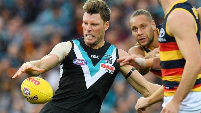 Brad Ebert gets his kick away while under pressure from the Crows. Picture: David Mariuz/AAP                        <a capiid="8e51b50d1dcb8cb7a621b07a745bc521" class="capi-video">Hocking reveals new committee</a>