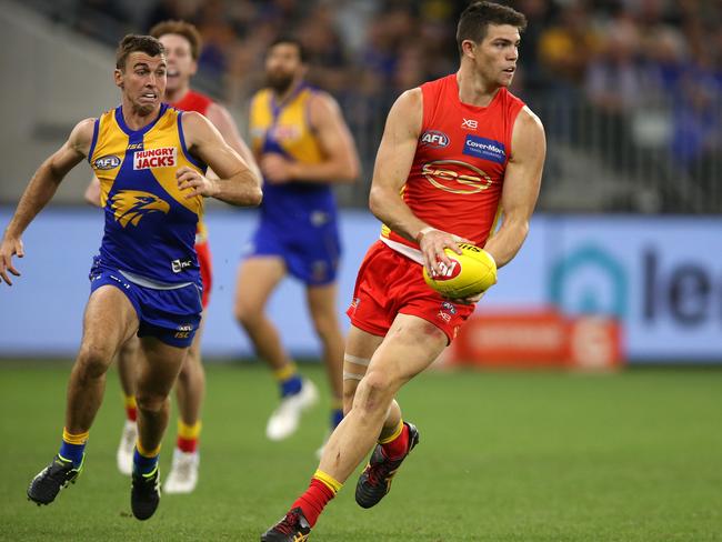 Sam Collins of the Suns looks to pass the ball during the round seven AFL match between the West Coast Eagles and the Gold Coast Suns at Optus Stadium on May 04, 2019 in Perth, Australia. (Photo by Paul Kane/Getty Images)