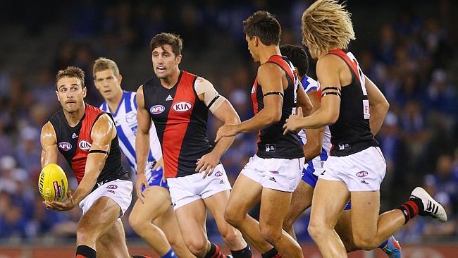 Jobe Watson of the Bombers handpasses the ball during the Round 1. Photo by Michael Dodge