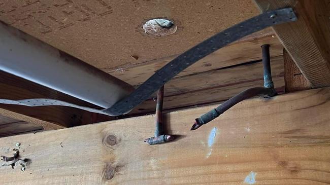 Thieves crawled under the deck of a home before making off with several kilograms of copper pipe. Picture: Supplied