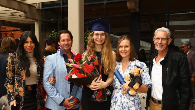 Graduate Kymberley McMurray with step mum Bianca McMurray, left, dad Peter McMurray, mum Amanda Martin and step dad Bryan Martin at the Deakin University Graduation post ceremony celebration. Picture: Alison Wynd