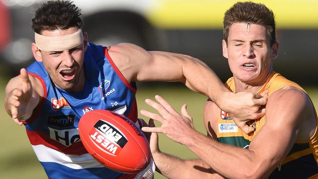 Central’s John Butcher battles Eagle Luke Thompson. Picture: Roger Wyman