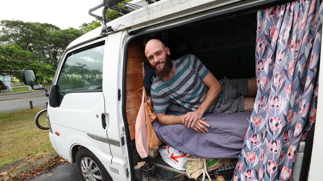 Belgian tourist Robin Pakuszewski, whose flight was cancelled, was expecting to have to stay in his van through the cyclone in Brisbane. Picture: Annette Dew