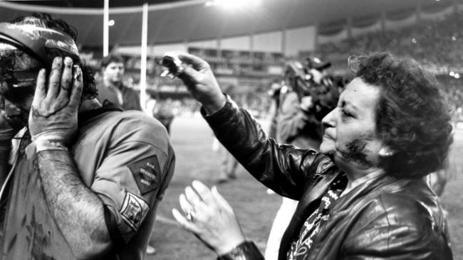 Ben Elias with blood coming from a head wound, with his worried mother. Picture: Anthony Weate