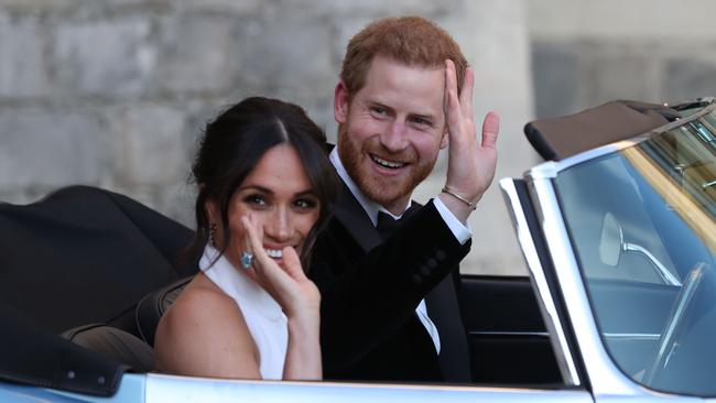 Prince Harry behind the wheel of that E-Type Jaguar after their wedding en route to the reception at Frogmore House.