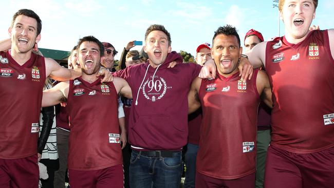 Brett Backwell sings the song with his PAOC players after the 2016 grand final win. Picture: Stephen Laffer