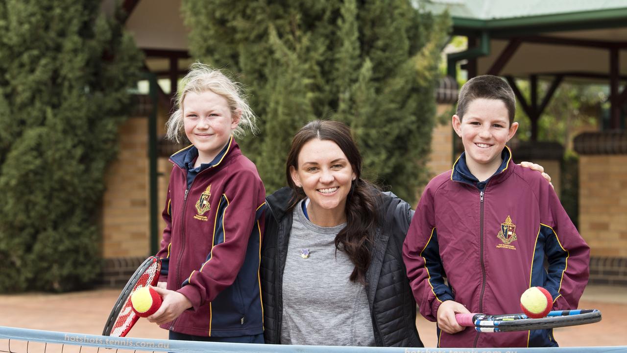 Casey Dellacqua with Toowoomba Anglican School students Felicity Taylor and Tom Dewar. Picture: Kevin Farmer