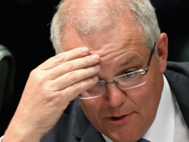 Prime Minister Scott Morrison feels the strain during question time. Picture: Tracey Nearmy/Getty Images